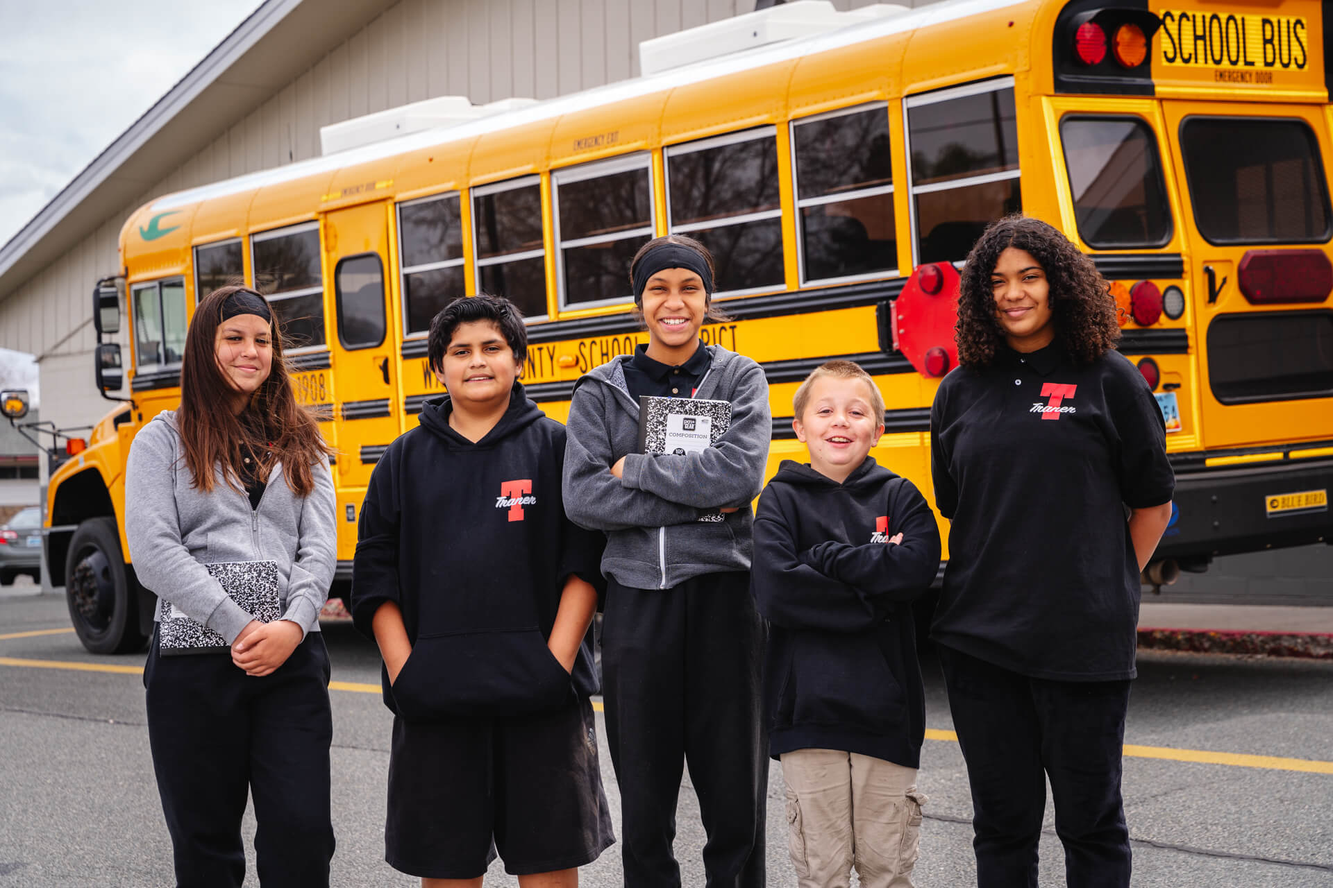 CIS WNV Group Photo with Trander Middle School Students and School Bus