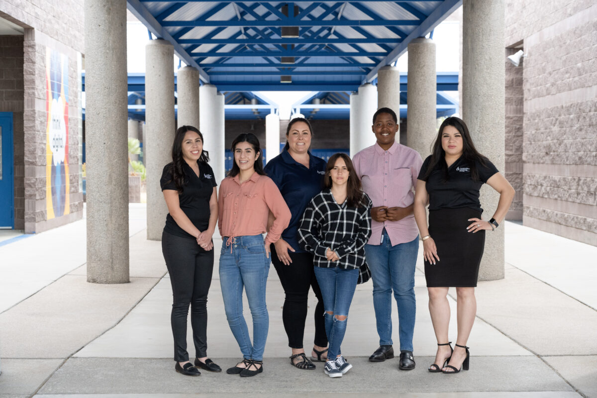 CIS students with site coordinators at school